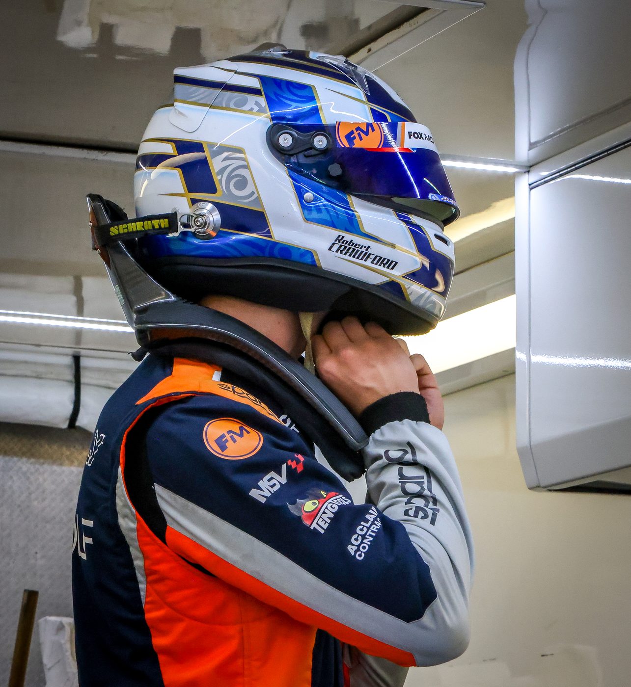 Robert Crawford in his race helmet and Fox Motorsport suit