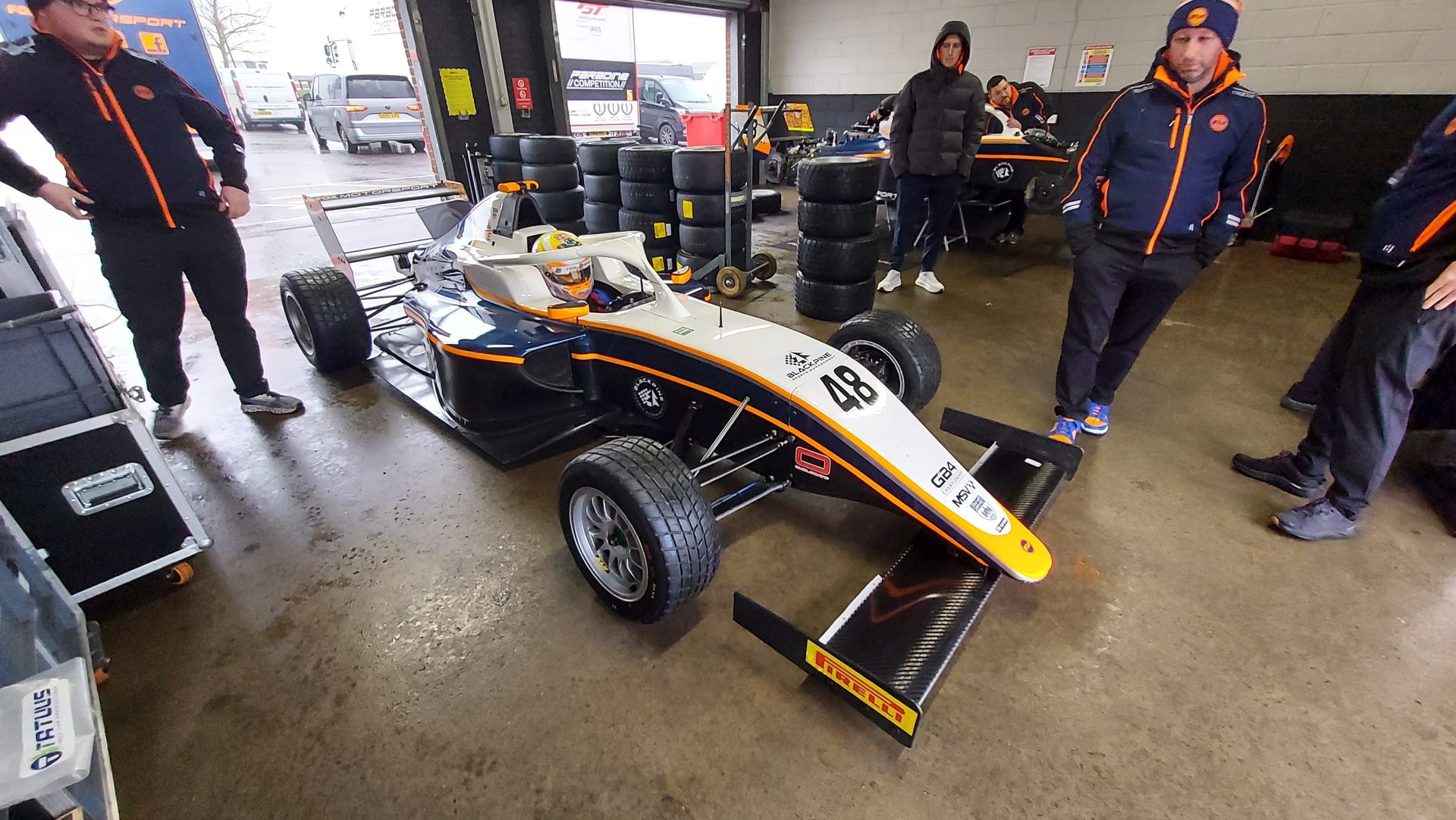 Fox Motorsport team with GB4 car #48 in the garage
