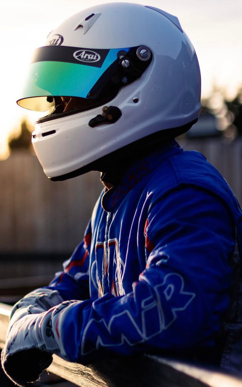 Robert Crawford in race suit at golden hour